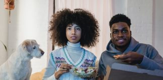 Watching a movie. Photo by Andres Ayrton from Pexels.